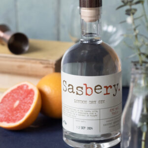 Sasbery London Dry Gin bottle with fresh grapefruit, crafted in Surrey at Loseley Park